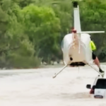 Helicopter Pilot Drops Police Officer Onto Flooded Car to Save Stranded Pair in Katherine